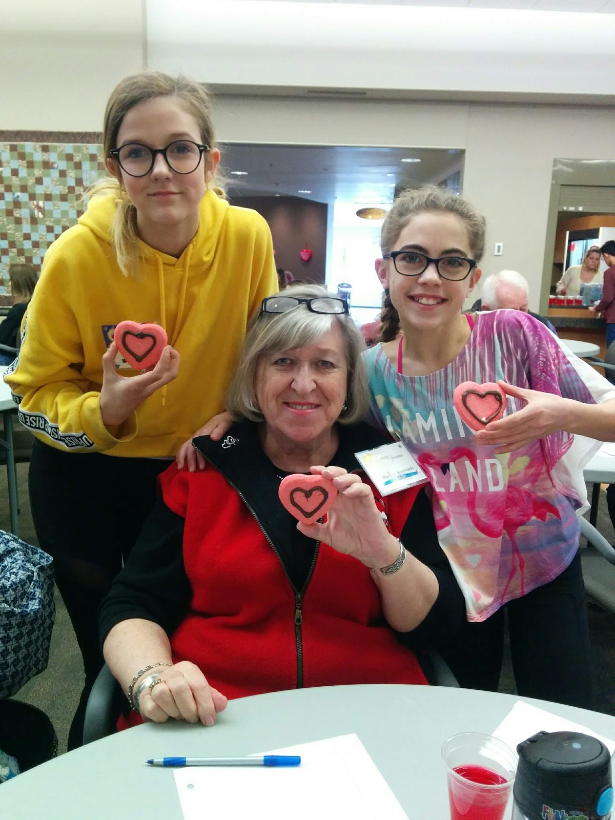 Senior and two kids pose for a photo during a linking generations event