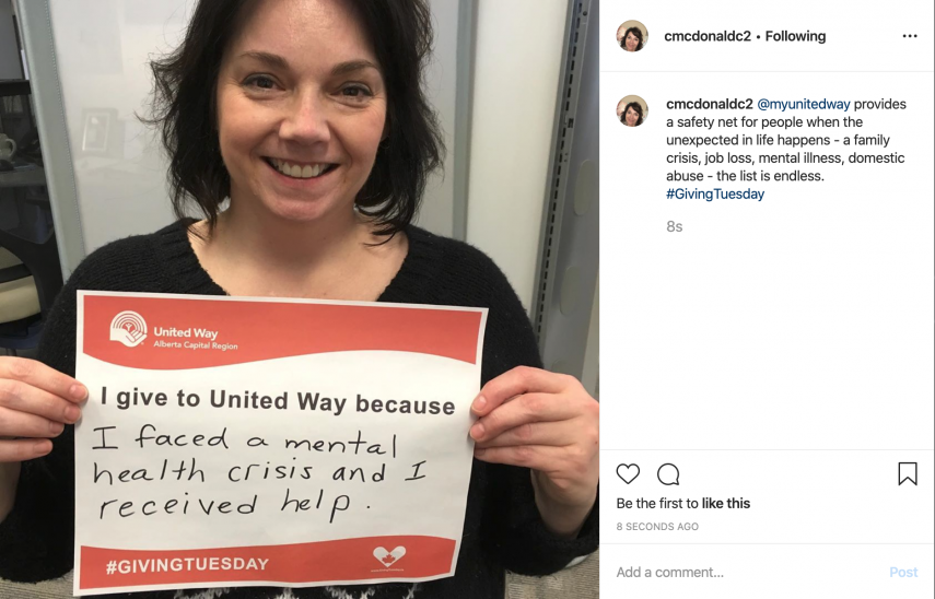woman holding up sign to celebrate