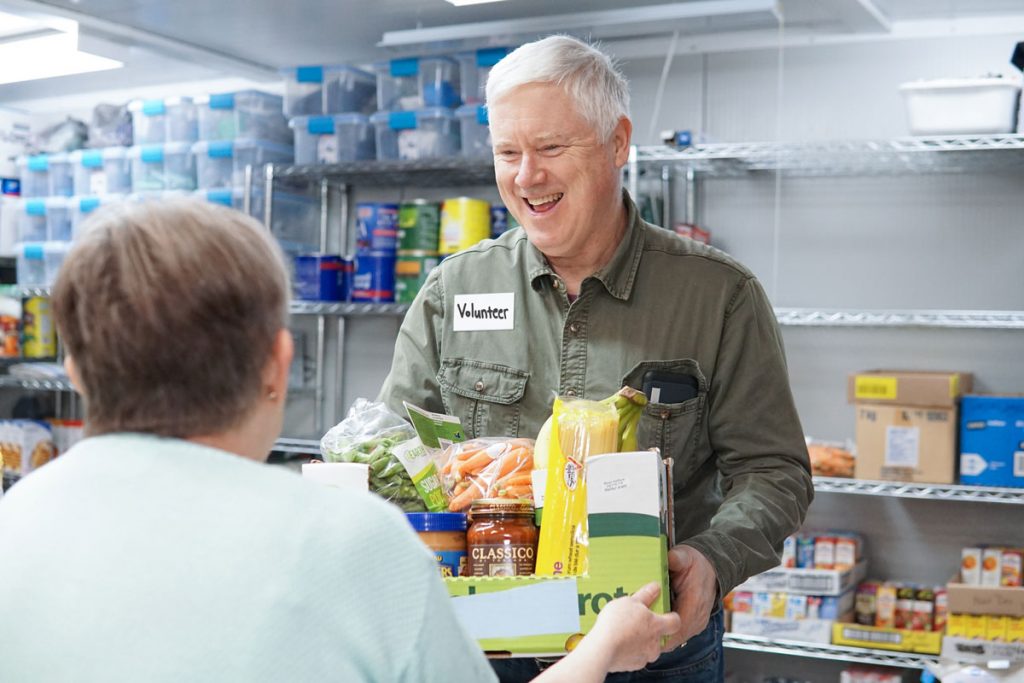 Volunteer to build food hampers hero image