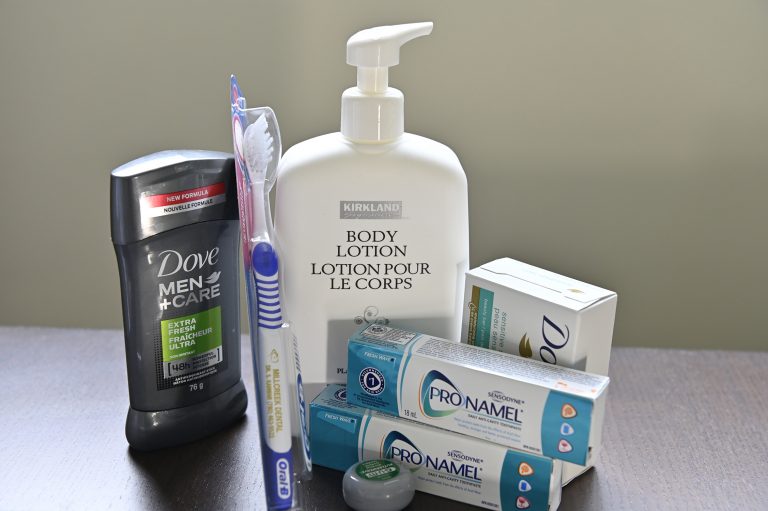 A person builds hygiene kit to donate to United Way of the Alberta Capital Region though their Volunteer At Home campaign.