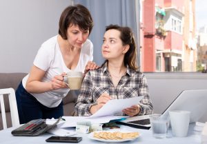 Women Working with Documents While Working at Laptop at Home by Iakov Filimonov from Canva