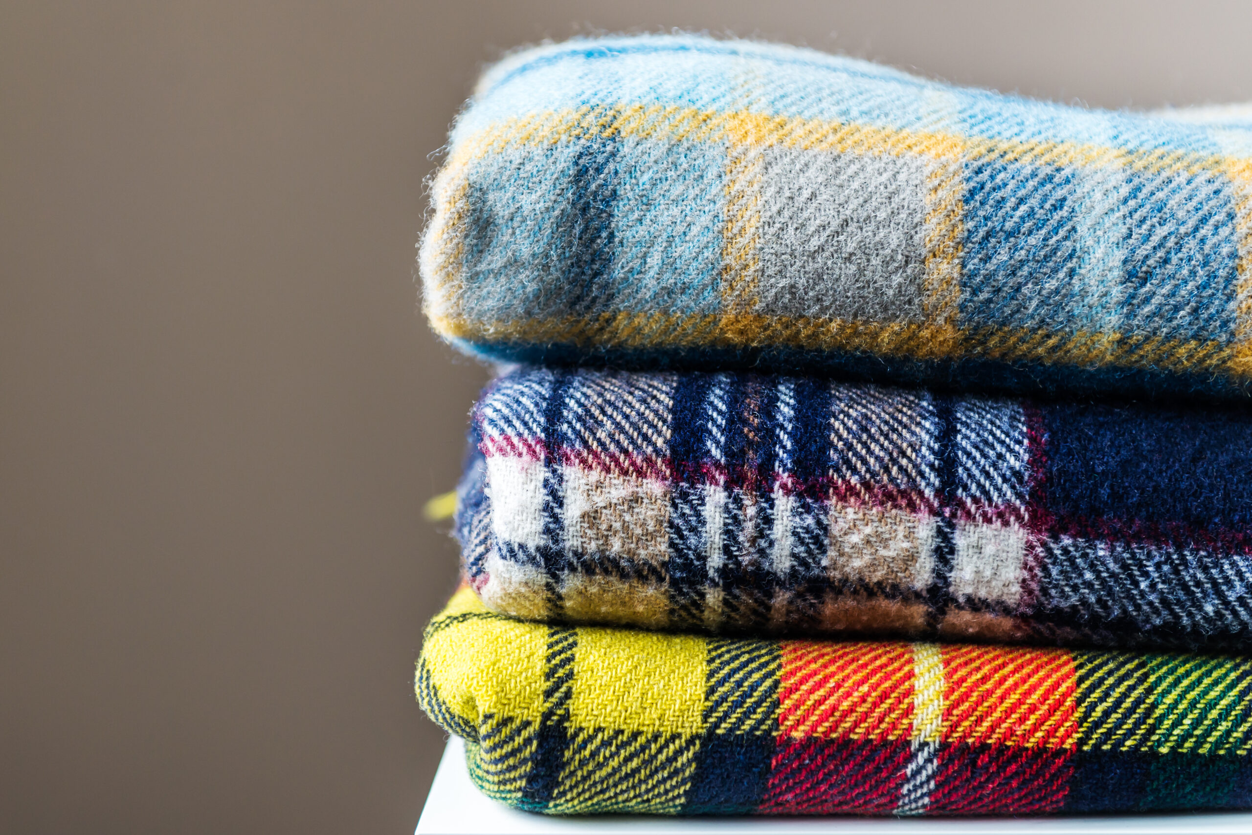Stack of woolen checked blankets