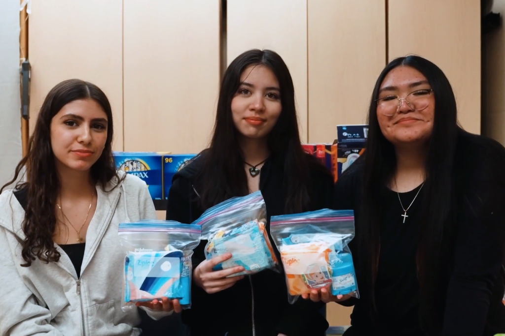 St. Clement School students package menstrual products to distribute to vulnerable people in the Edmonton area during their Make Your Mark project.