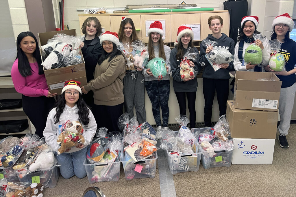 St. Rose School students package books and stuffies to share with younger students at a neighboring Edmonton Catholic school as part of their Make Your Mark project.