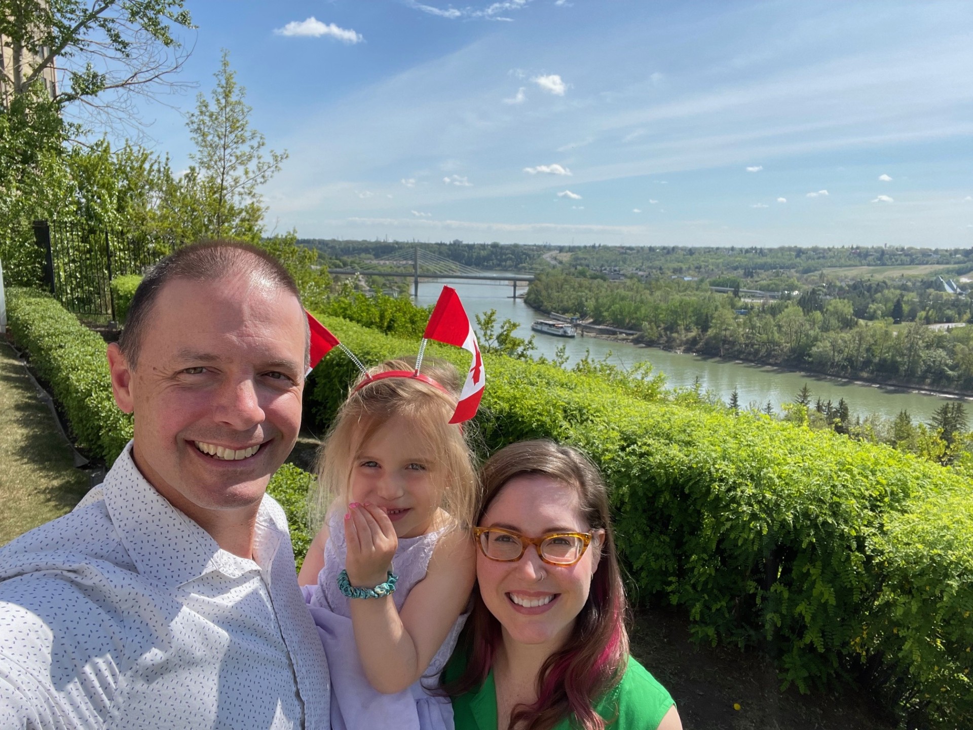 Jason Schauenberg taking a selfie with his wife and daughter outside on Canada Day.